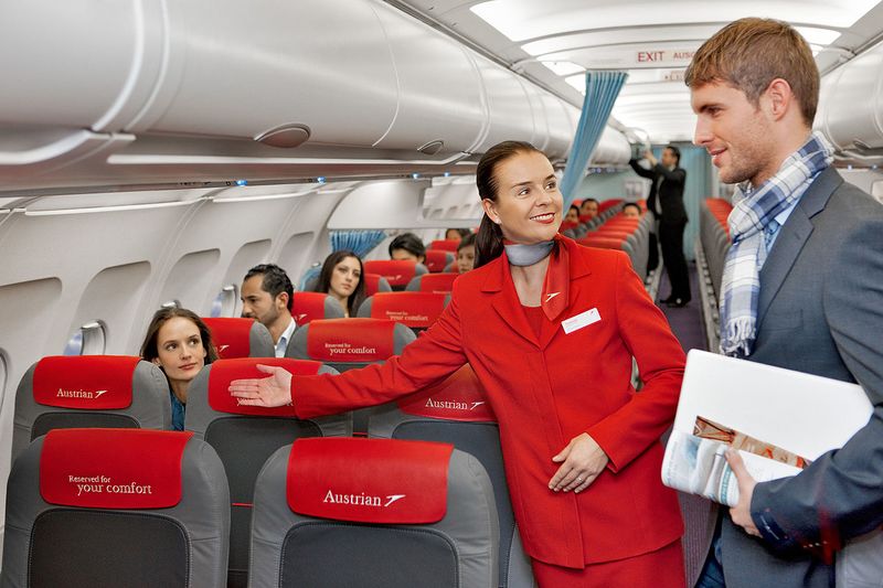 Fichier:Austrian Airlines flight attendant and passenger.jpg